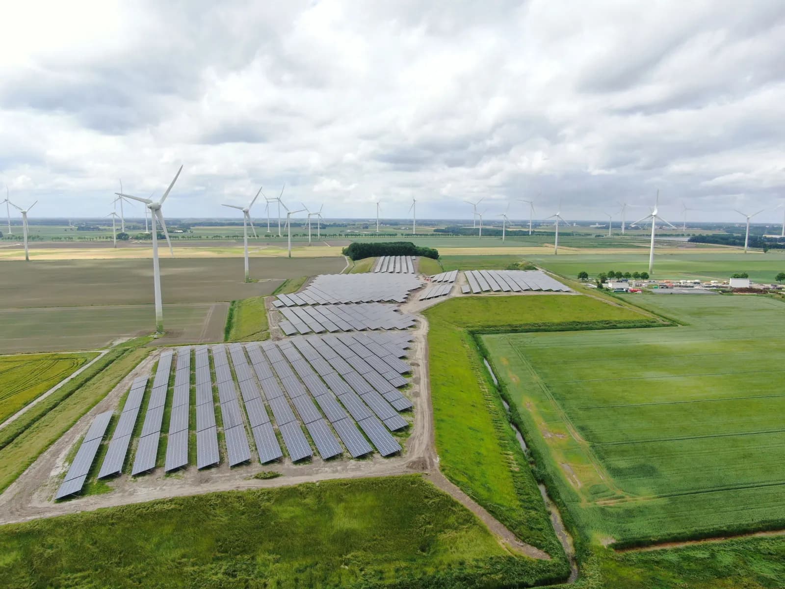 Solar panels and wind turbines at a remediated landfill area in Farmsum, Netherlands